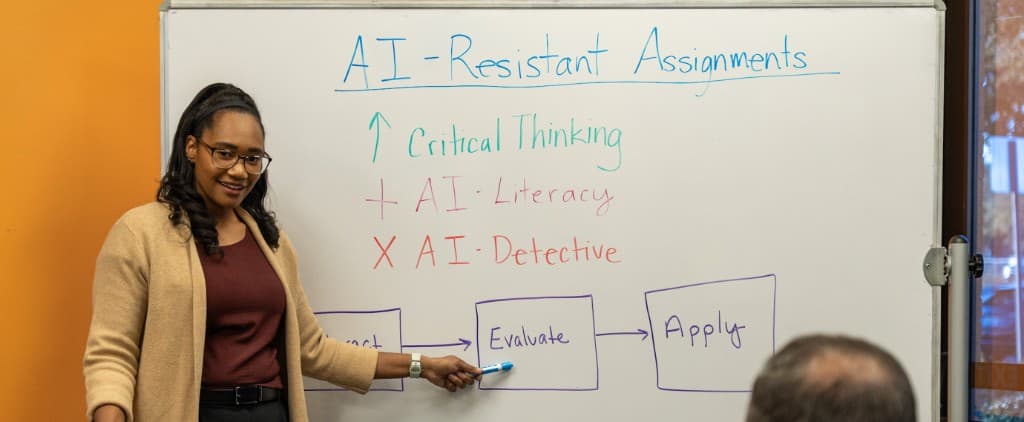 Ashley Evans at a whiteboard teaching AI-Resistant Assignments
